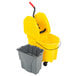 A yellow Rubbermaid WaveBrake mop bucket and gray dirty water bucket on wheels with a handle.