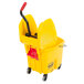A yellow Rubbermaid mop bucket with a red handle.