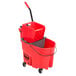 a red mop bucket and bucket