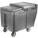 A grey plastic Cambro ice bin with wheels.