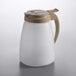 a white and brown coffee pot