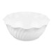 A close up of a white Cambro Camwear swirl bowl with a wavy design.