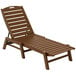 A brown POLYWOOD Nautical folding chaise lounge chair.