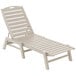 A white POLYWOOD Nautical chaise lounge chair with slats.