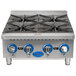 A Globe stainless steel countertop gas hot plate with three burners.