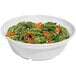 A close-up of a white Sonoma melamine bowl filled with green beans and carrots.