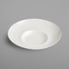 A RAK Porcelain ivory porcelain plate with a curved edge.