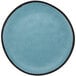 A matte speckled blue melamine coupe dinner plate with a black rim.