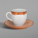 A RAK Porcelain Woodart white and brown espresso cup and saucer.