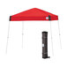 A red E-Z Up Vista canopy with a white frame and a black bag on the side.