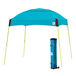 A blue tent with green poles and a lime green bag.