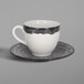 A RAK Porcelain beech grey coffee cup and saucer with a white interior and black rim.