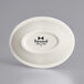 A white oval Tuxton china monkey dish with black text.