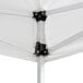 A white Backyard Pro canopy with black metal brackets.