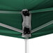 A green tent with black metal supports.