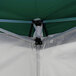 A white tent with a green cover set up on a white background.