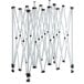 A white folding structure with black handles under a Backyard Pro Courtyard Series canopy.
