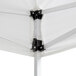 A white Backyard Pro canopy with black metal brackets.