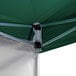 a green tent with white fabric