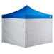 A blue tent with white fabric walls on a white surface.