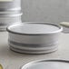 A round silver container with a round lid.
