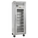 A Traulsen wine refrigerator with a glass door and shelves.