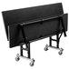 A black National Public Seating ToGo bench on wheels.