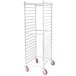 An unassembled Winholt sheet pan rack with red wheels.