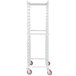 A white Winholt unassembled sheet pan rack with red wheels.