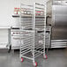 A Winholt unassembled aluminum sheet pan rack.