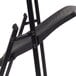 A black National Public Seating AirFlex folding chair with metal legs.