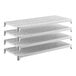 A set of four white vented plastic shelving units designed for stationary storage.