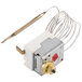 A small metal device with wires attached.