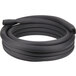 a black coiled hose on a white background