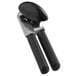 An OXO Good Grips can opener with a black handle.