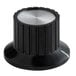 A black and silver Grand Slam temperature control knob.