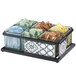 A Cal-Mil Granada condiment organizer with 6 glass jars filled with various types of tea, sugar, and condiments.