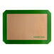 A tan rectangular Baker's Lane silicone baking mat with a green border.