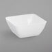 a white square bowl on a gray background