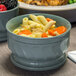 A close-up of a Dinex Turnbury insulated bowl with pasta and vegetables.