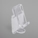 A clear plastic Snap Drape table skirt clip with a hook and loop attachment.