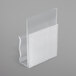 A close-up of a clear plastic Snap Drape table skirt clip with a white hook.