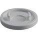 A white plastic lid with two holes and a handle.