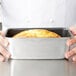 A loaf of bread in a Vollrath non-stick aluminum bread loaf pan.