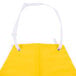 A yellow San Jamar dishwasher apron with white straps.