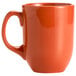 A Libbey Cayenne porcelain coffee mug with a handle in orange.