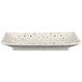 A rectangular white Elite Global Solutions melamine plate with black specks on it.