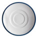 A close-up of a Libbey white porcelain saucer with a steel blue rim.