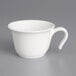 A Villeroy & Boch white porcelain cup with a handle.