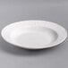 A Tuxton bright white china pasta bowl with a decorative design on it.
